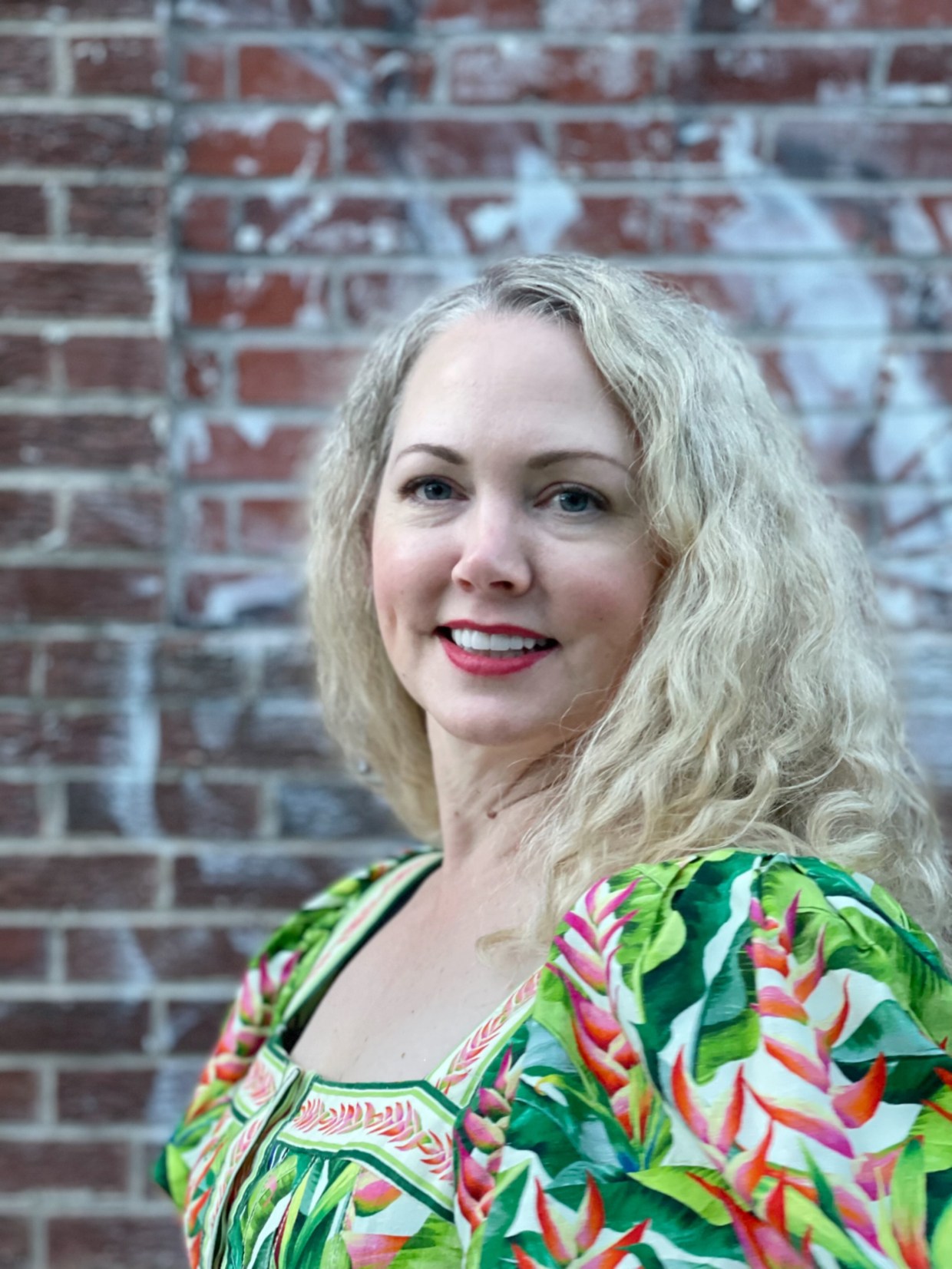 A blonde woman in a green shirt