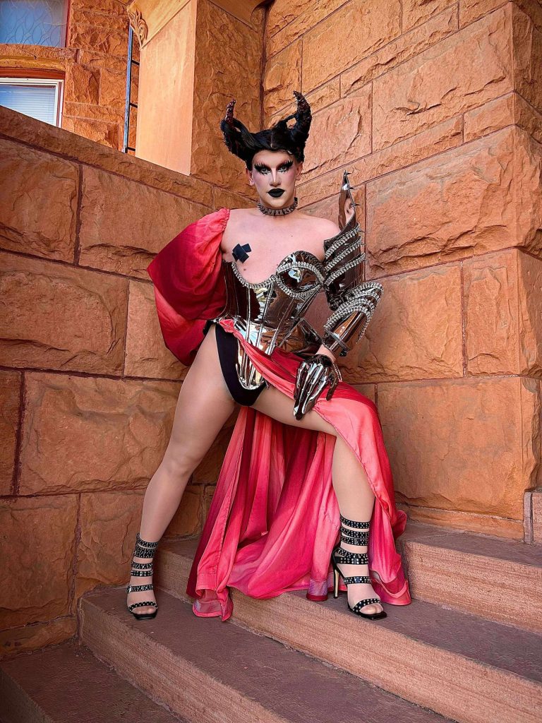 A drag queen in a red dress