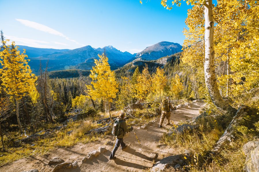 Two people hiking in autumn at Rocky Mountain National Park