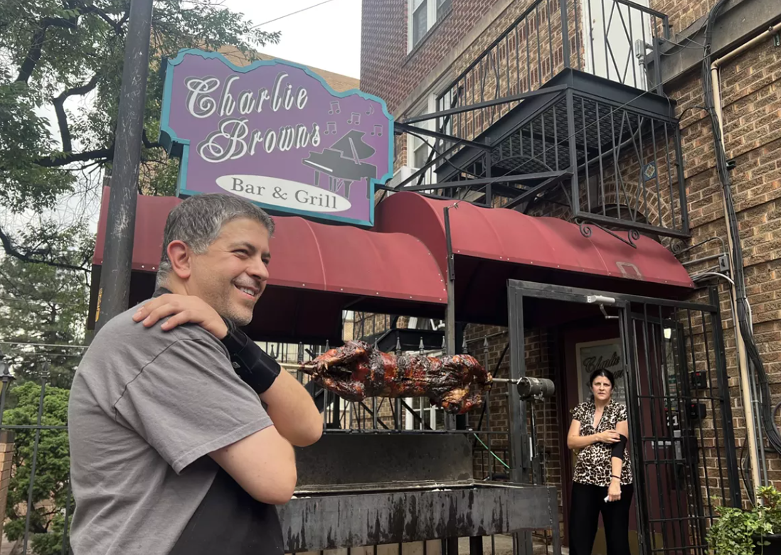 pig on a spit on a bar patio