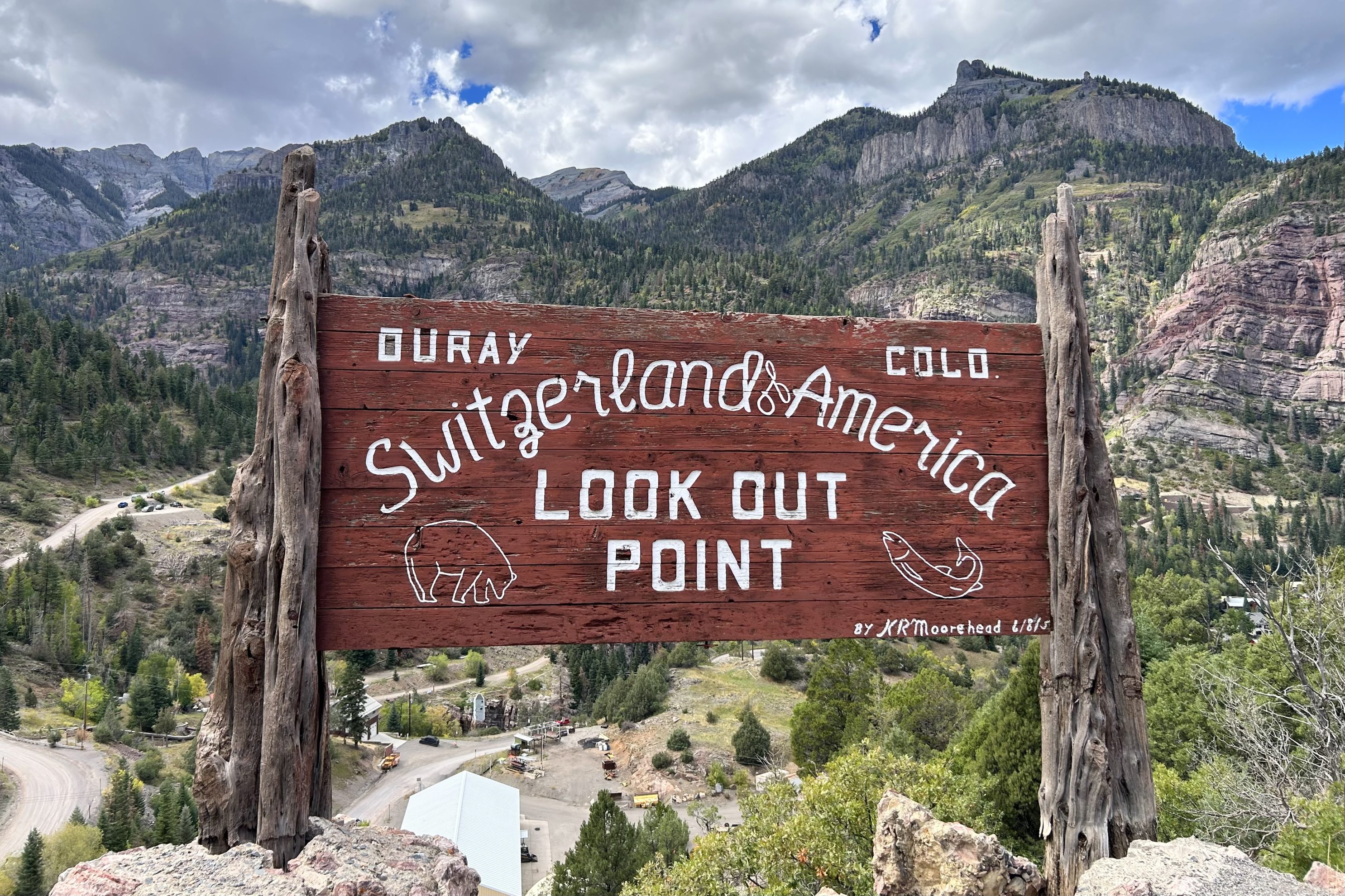 Ouray's "Switzerland of America" sign backdropped by mountain views