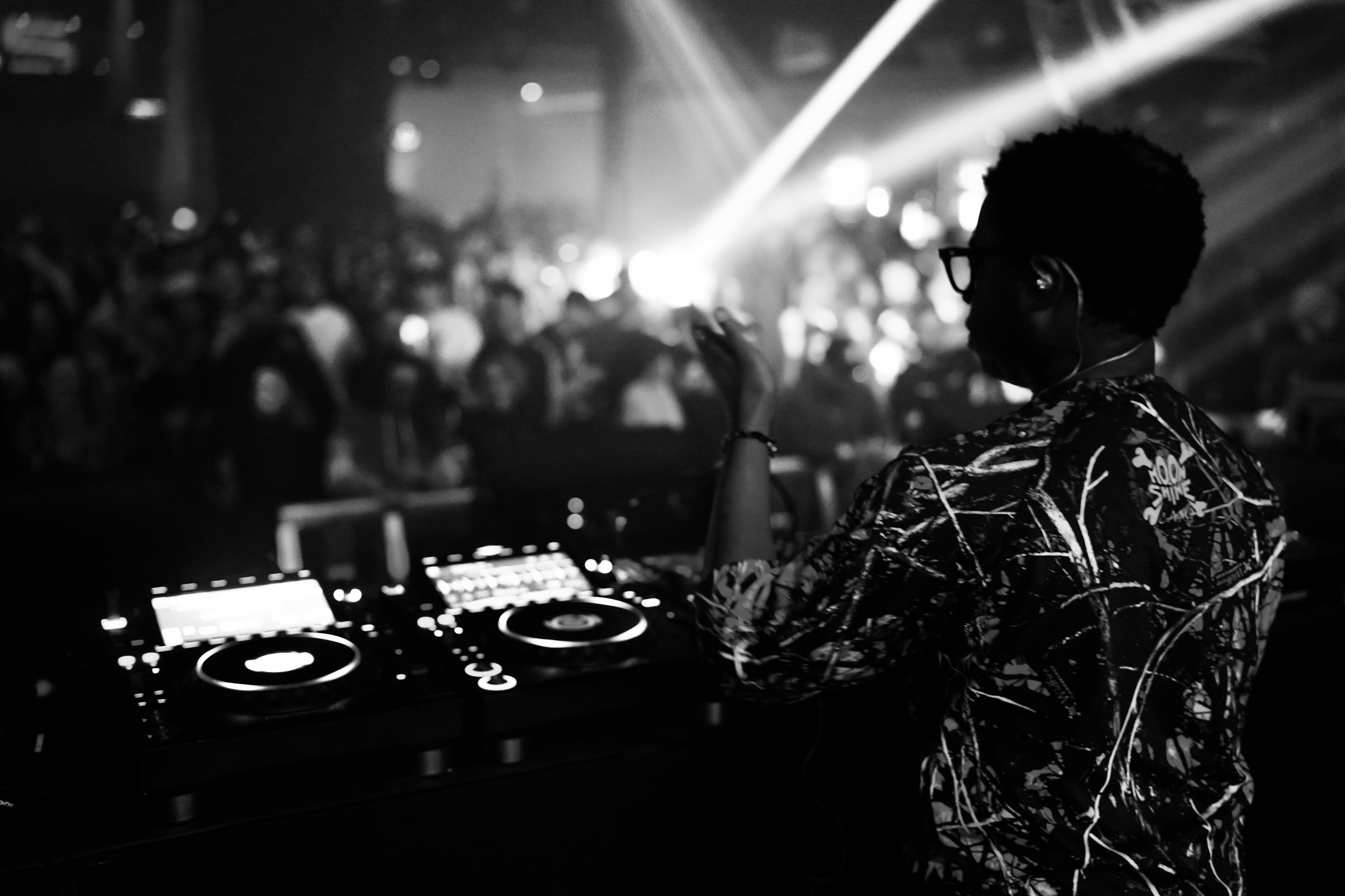 Denver DJ Sinistarr performing in front of a crowd