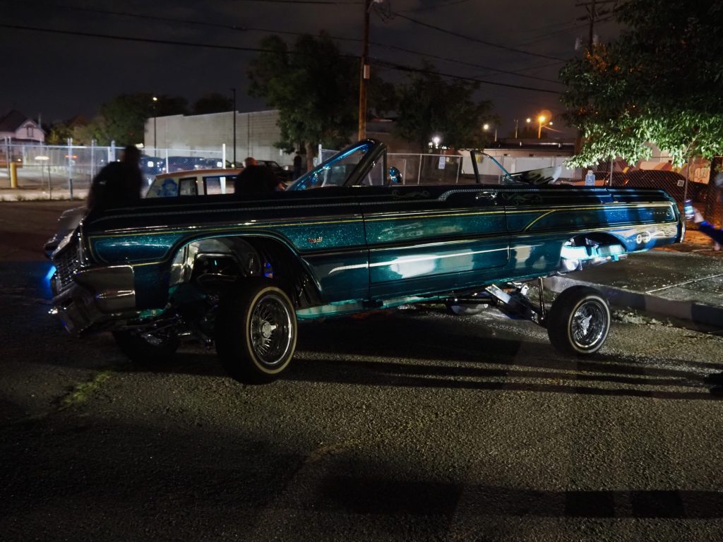 A low-rider car propped on its side
