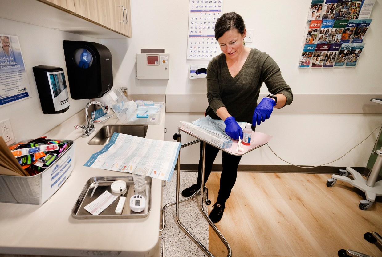 woman conduscts exam on patient