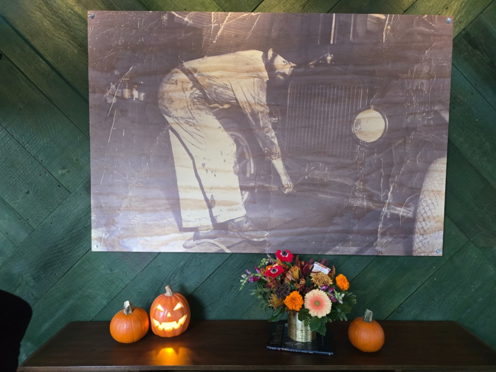 Black and white photo hanging on a wall