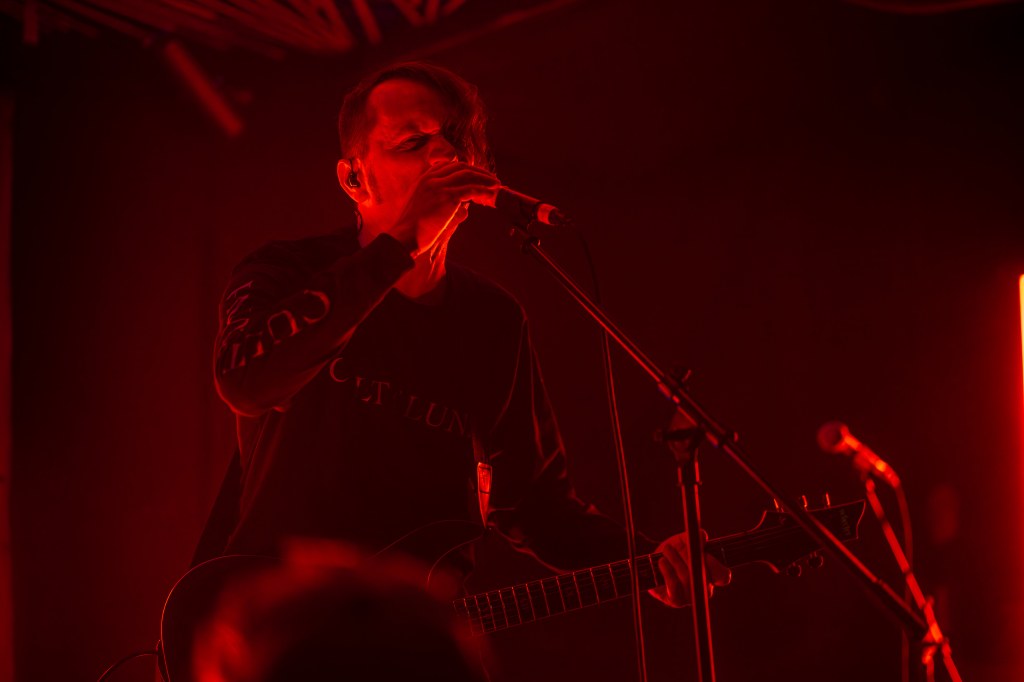 man singing into a microphone