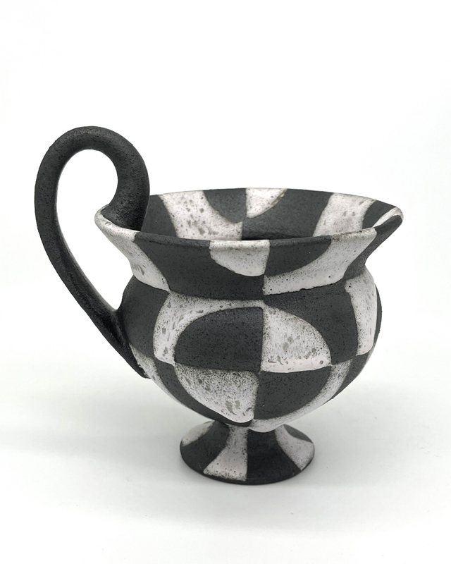 A black and white ceramic cup