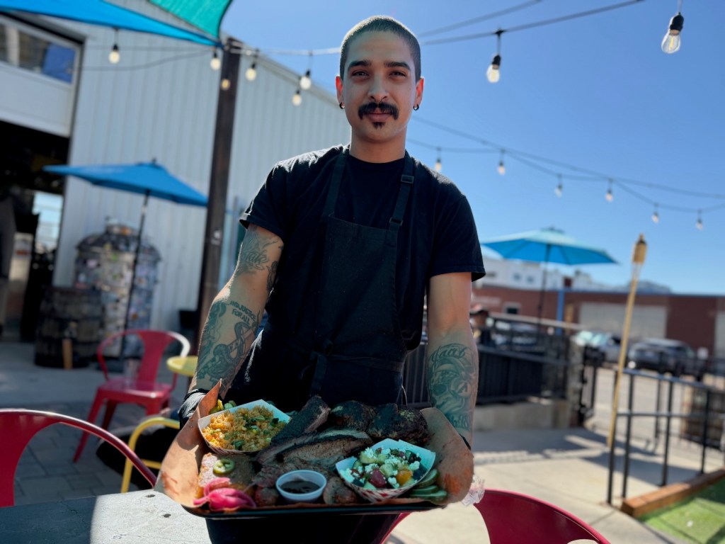 A man serving BBQ