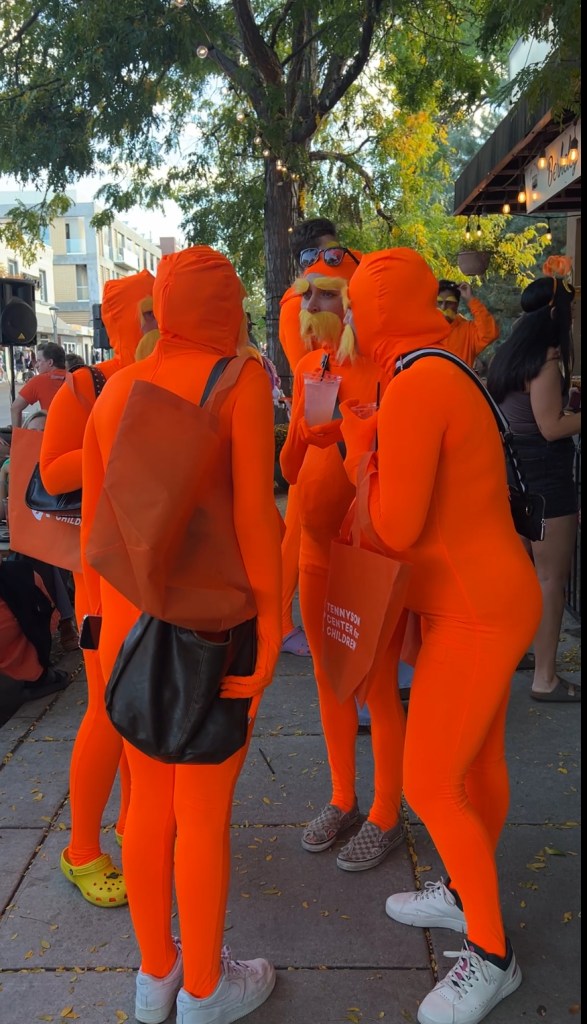A group of people in lorax costumes