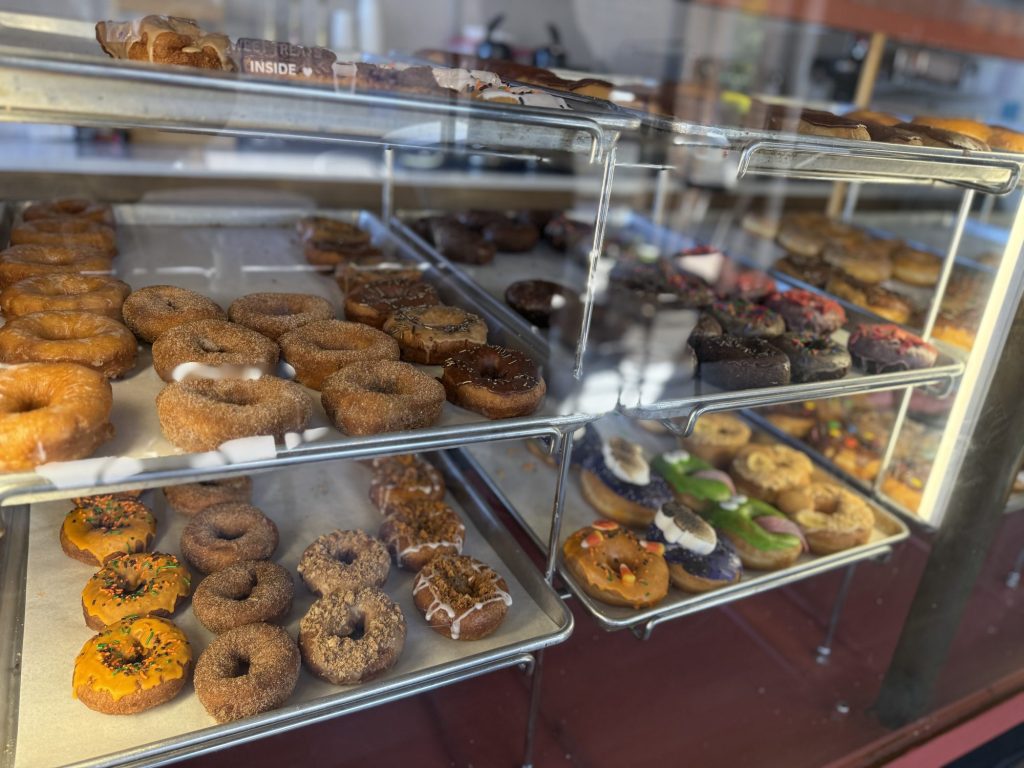 a glass display of donuts