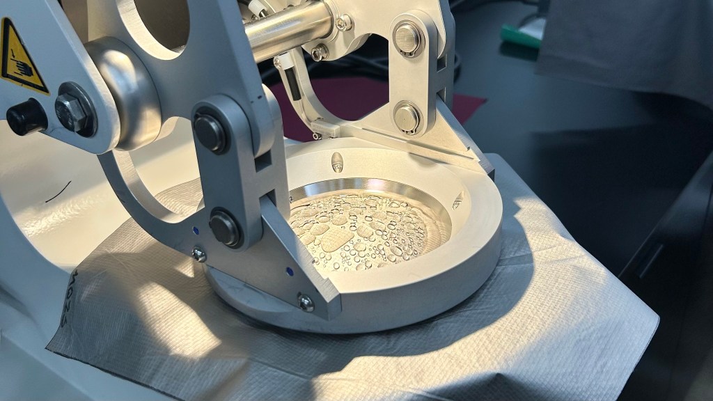 Beads of water on a metallic fabric during the hydrostatic head test