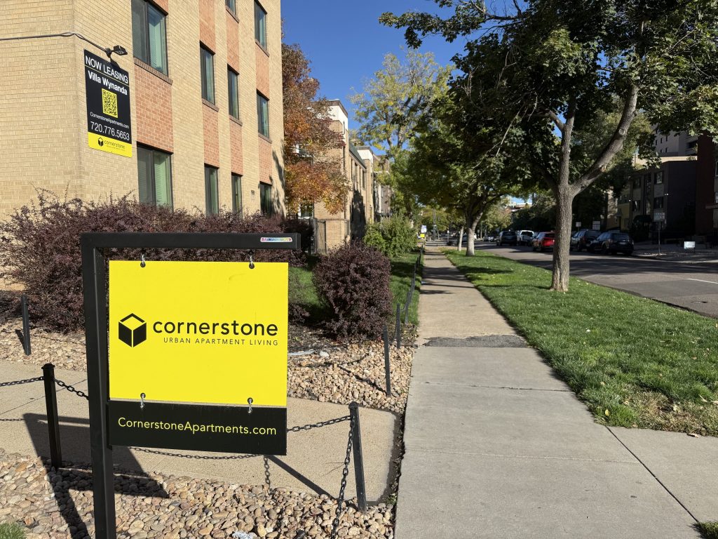 A yellow cornerstone sign