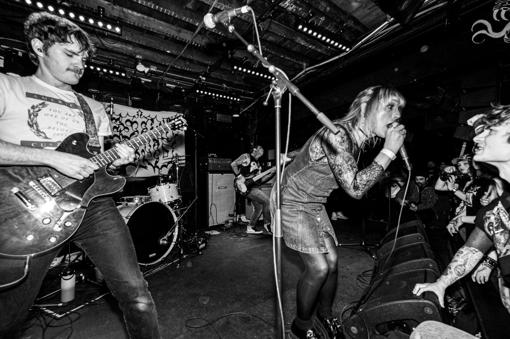 members of Denver band Destiny Bond performing at a punk venue
