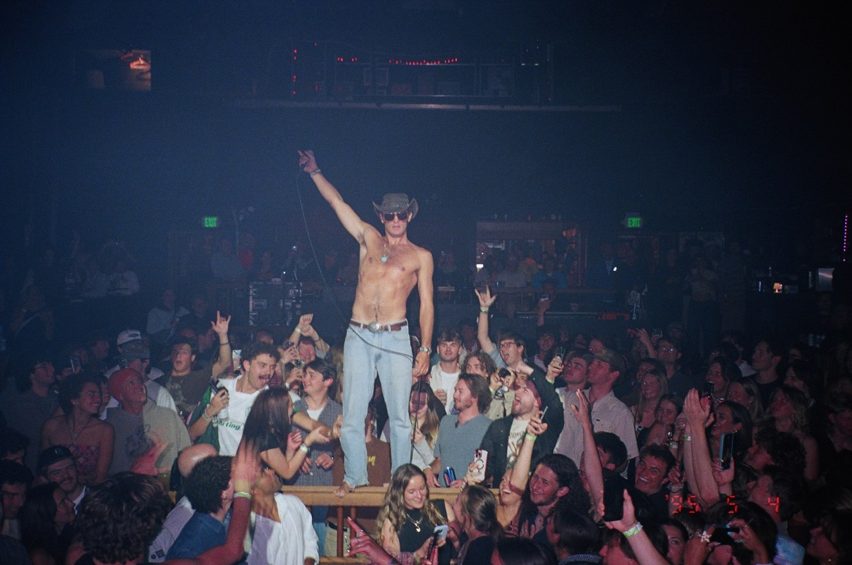 band on stage with a big crowd