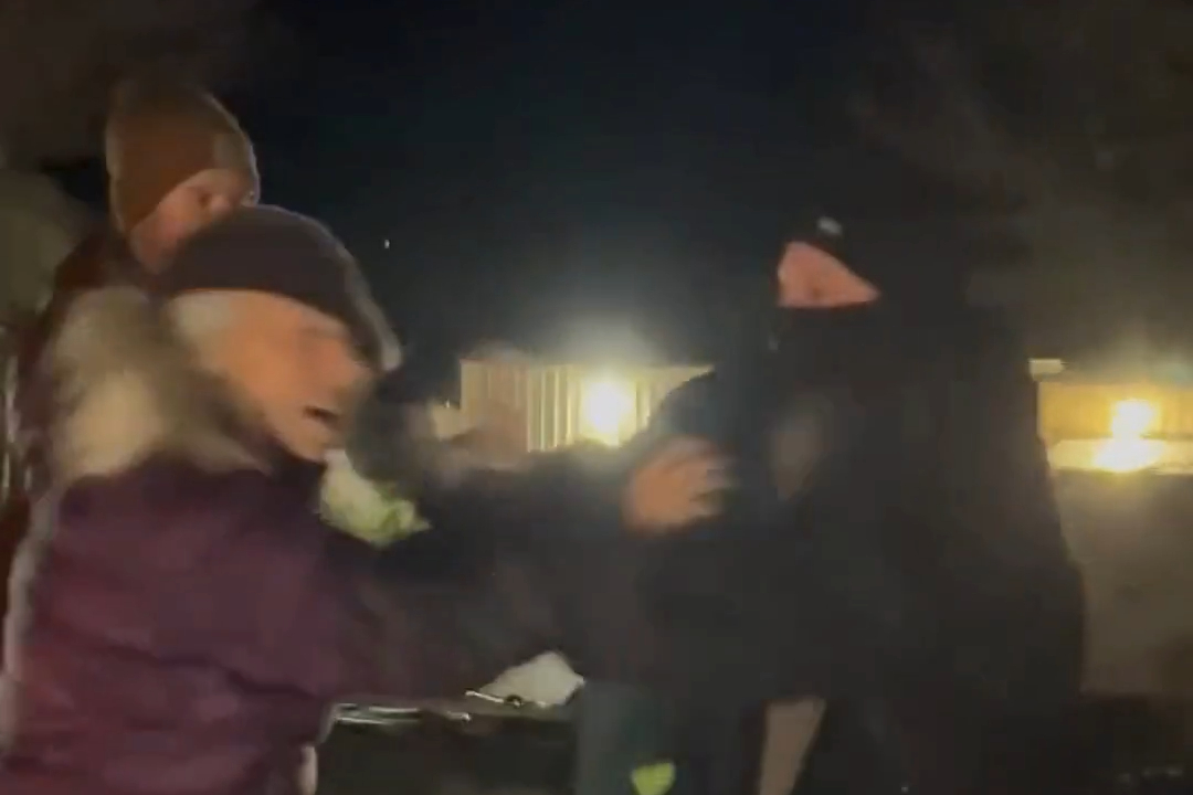 video screen shot of officer attacking protester