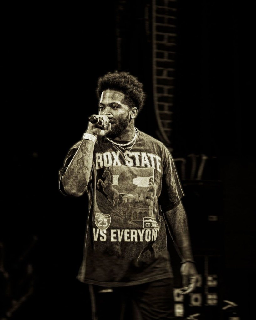 rapper on stage with a mic