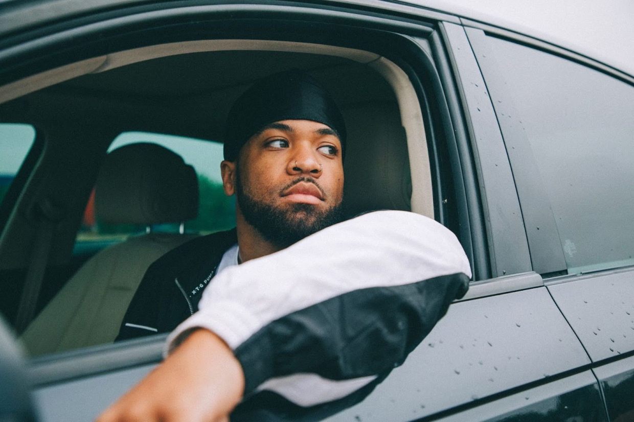 rapper Malcolm Whyz3 looking out a car