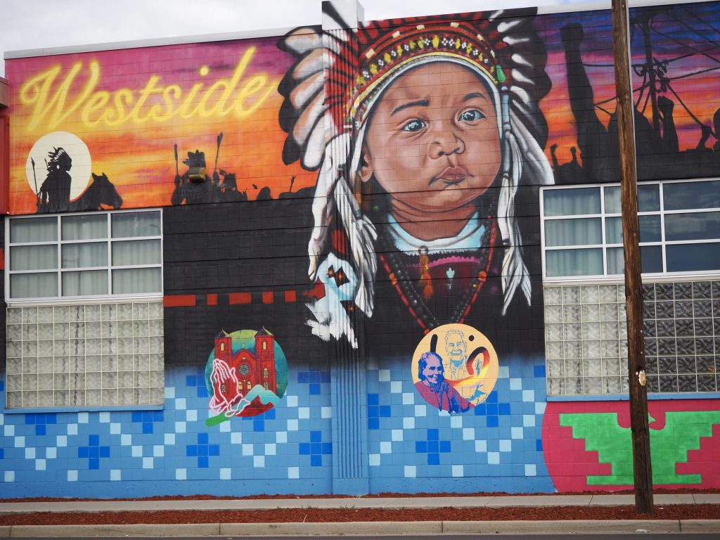 A mural of an indigenous baby