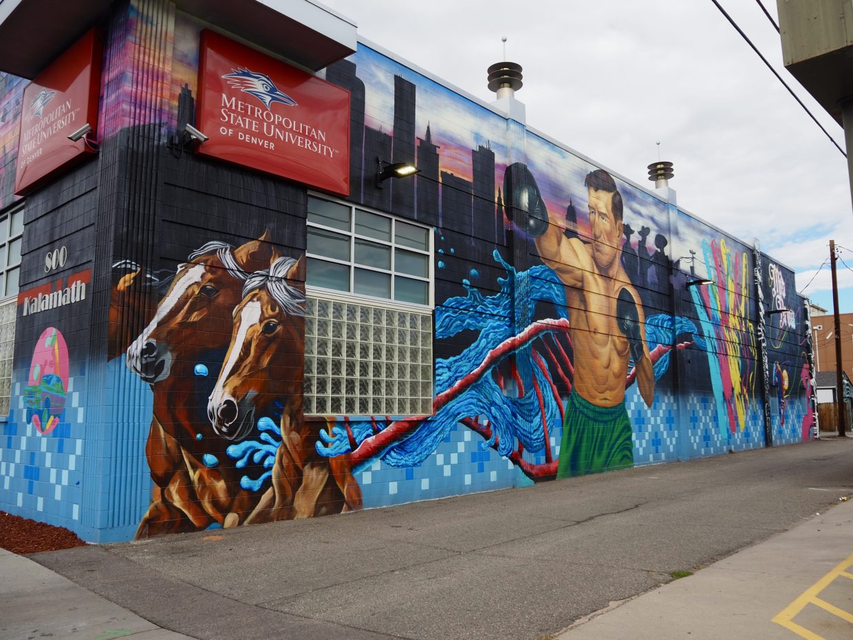 A mural of horses and a boxer