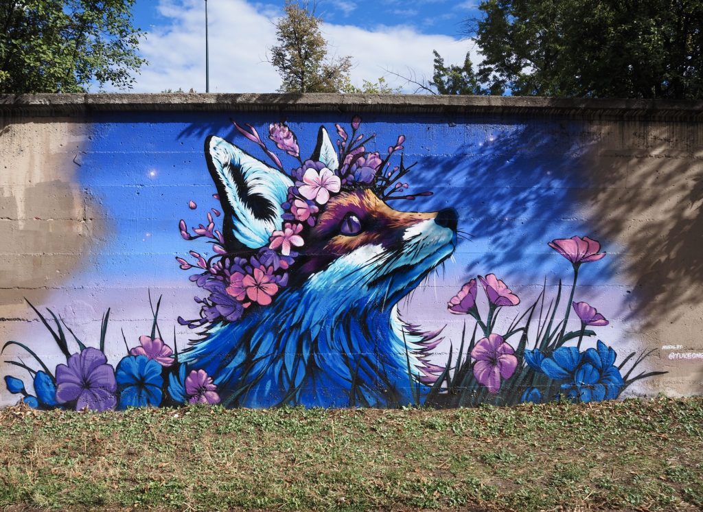 a colorful mural of a fox and flowers