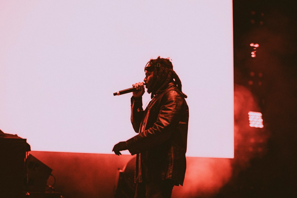 A photo showing Denzel Curry on stage at Red Rocks on October 31 for Halloween on the Rocks.
