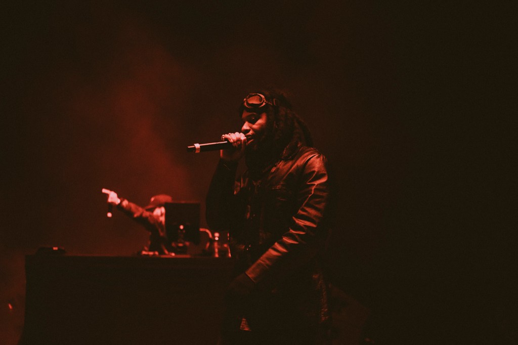A photo showing Denzel Curry on stage at Red Rocks on October 31 for Halloween on the Rocks.