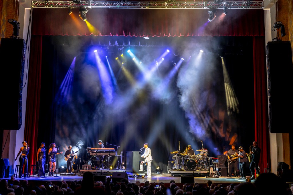 John Legend performing on stage at the Paramount Theatre on Wednesday, November 19.