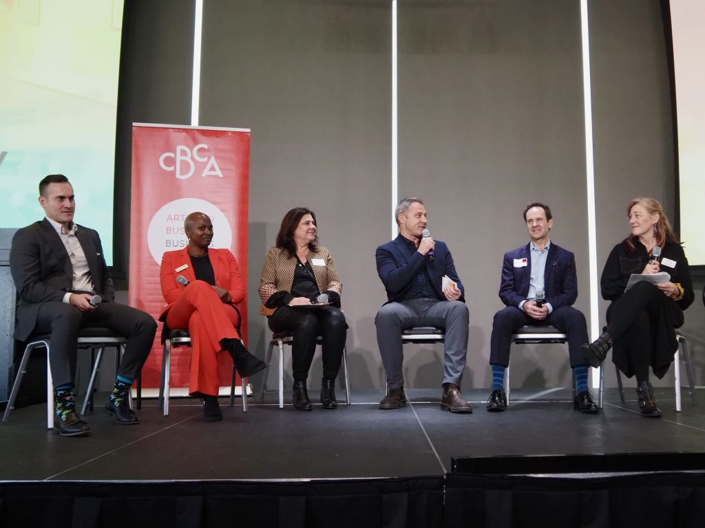 a panel of people speak