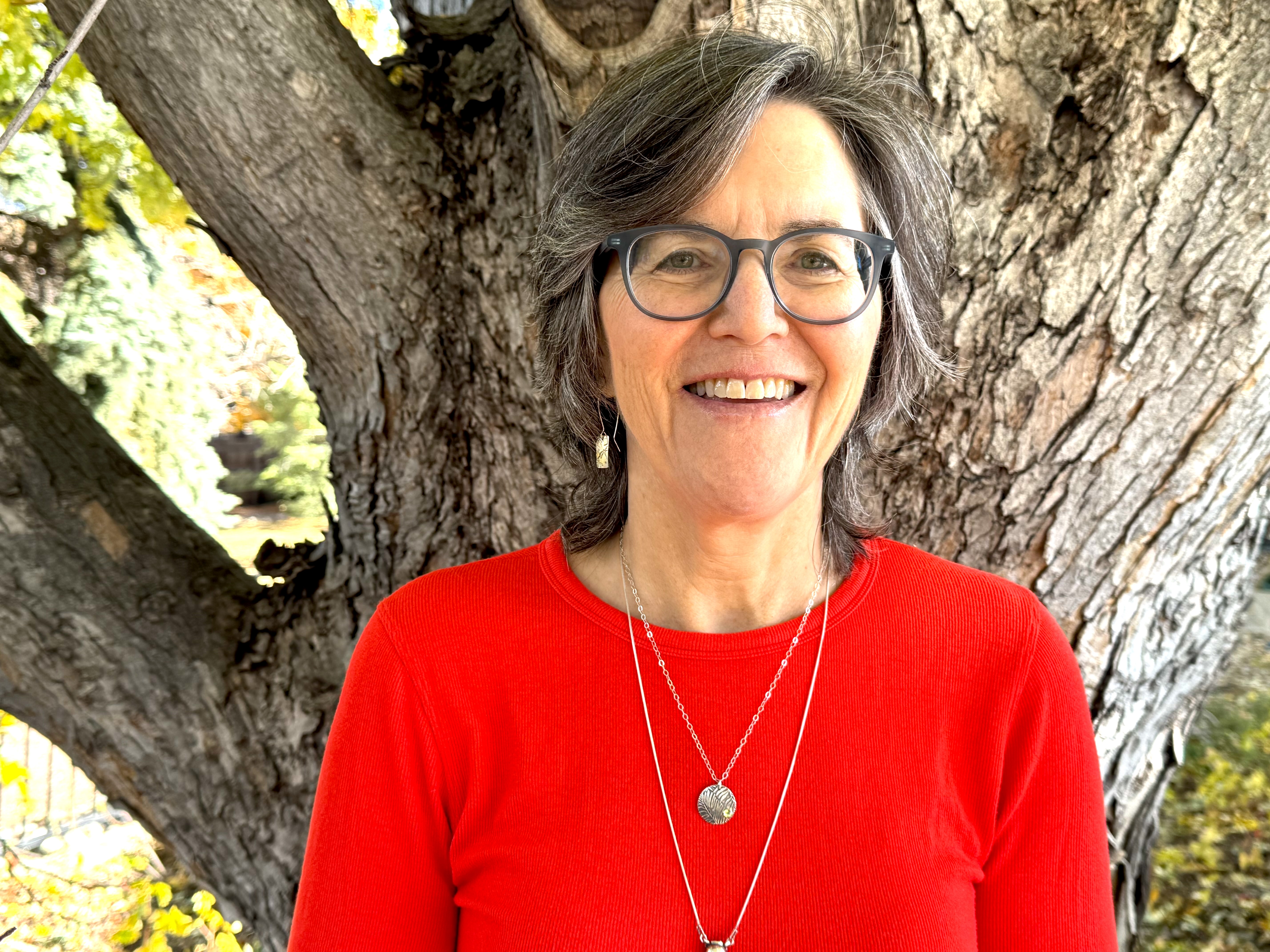 a portrait of a woman in a red shirt