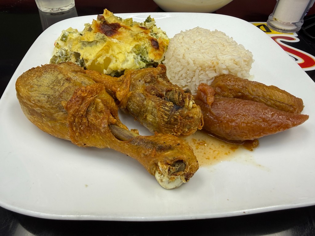 a plate of fried chicken and rice