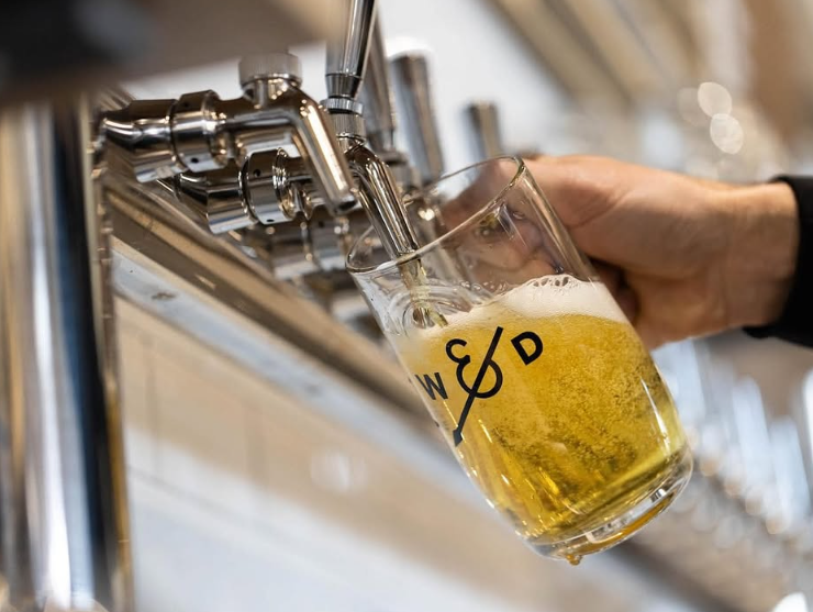 beer pouring into pint glass