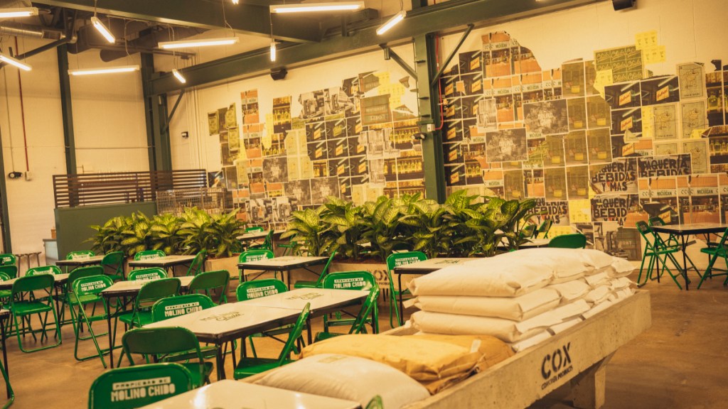 green folding chairs set at tables in a restaurant dining room