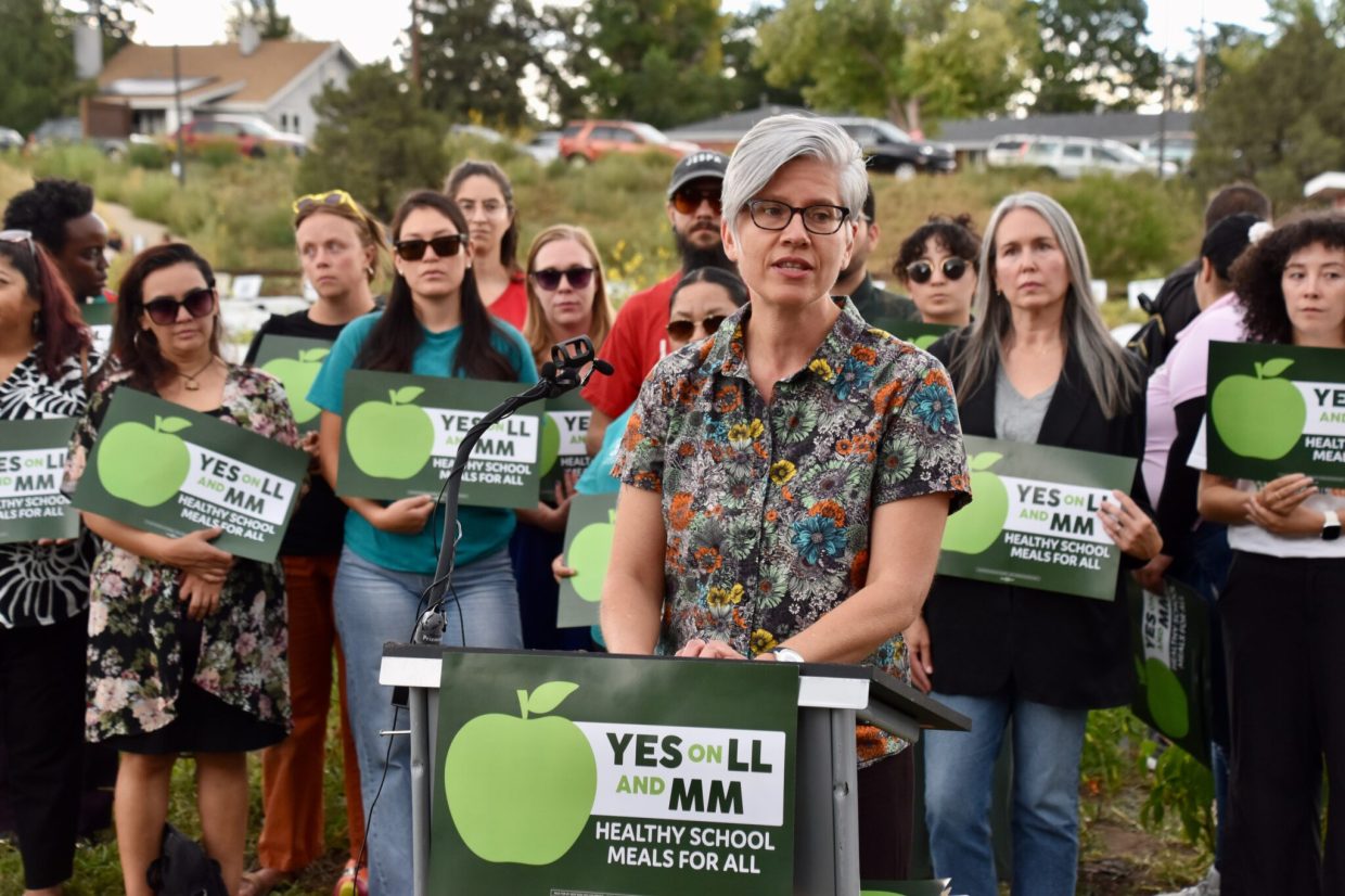 woman speaking at rally