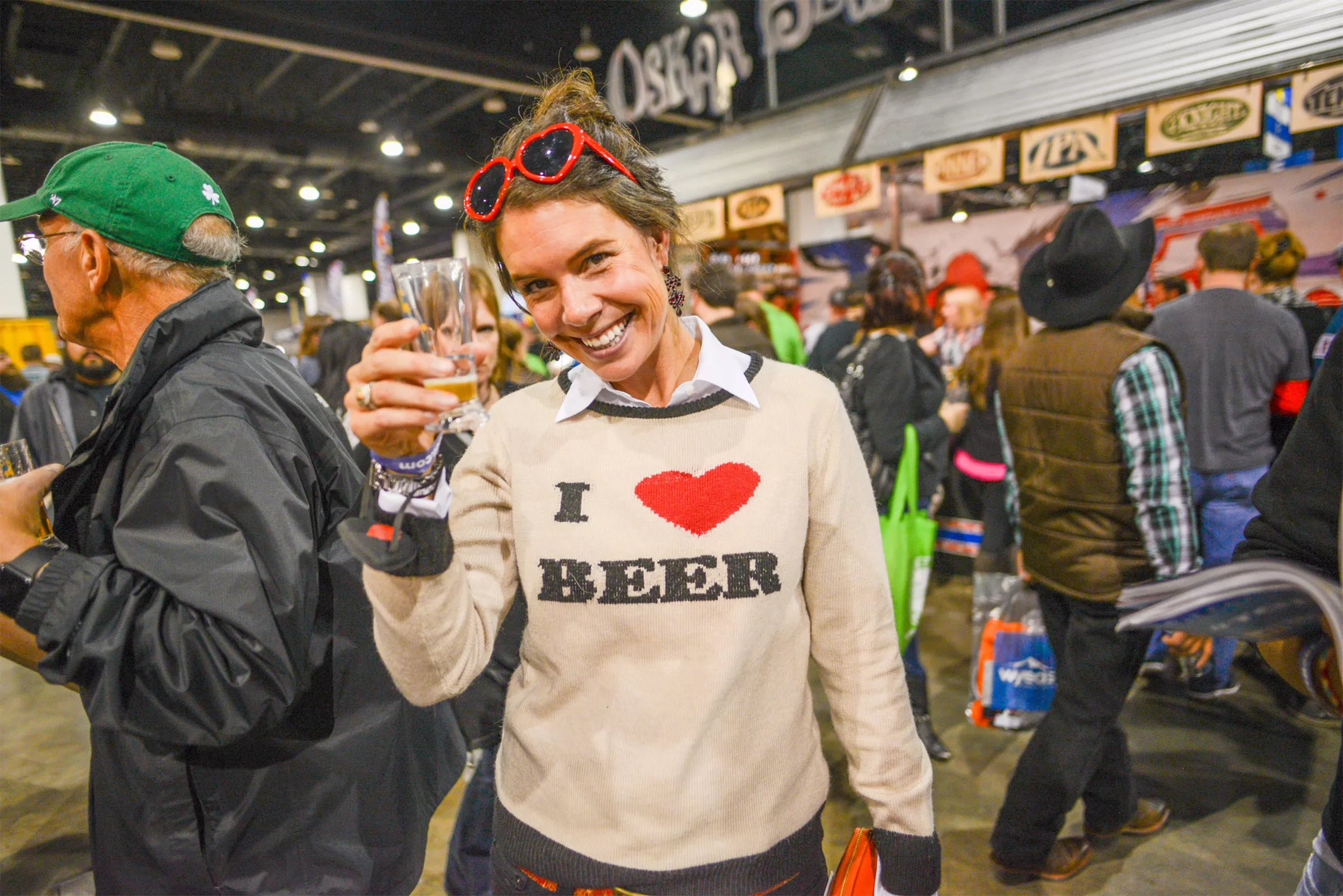 woman holding glass  at a beer fest
