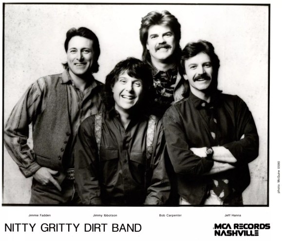 four men smiling