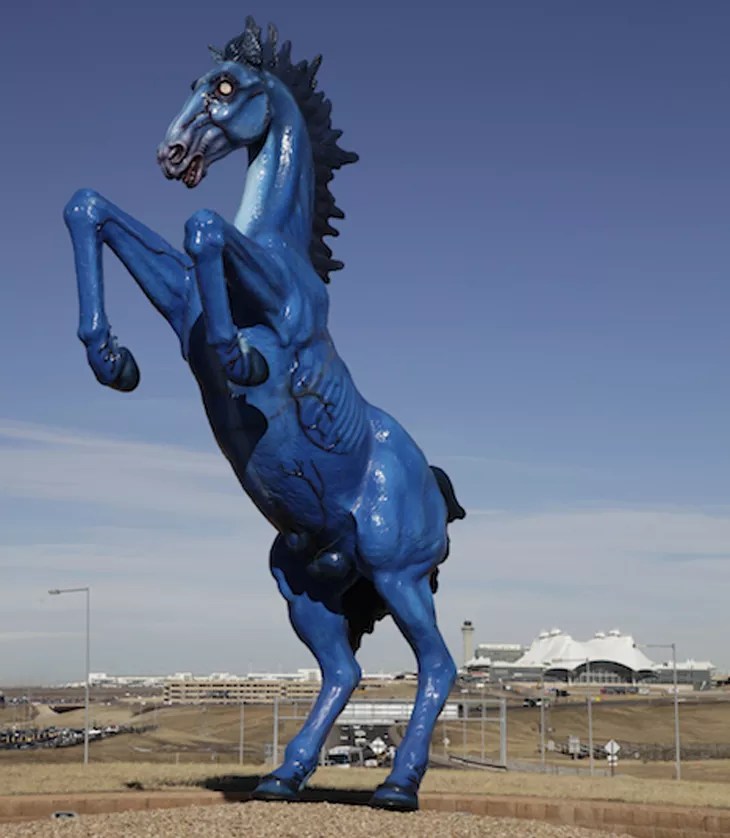 A sculpture of a blue horse