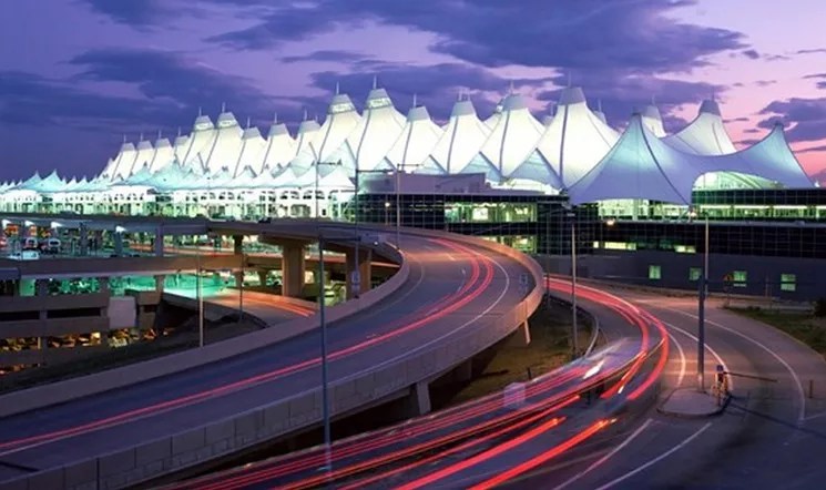 Denver International Airport lit up at night.