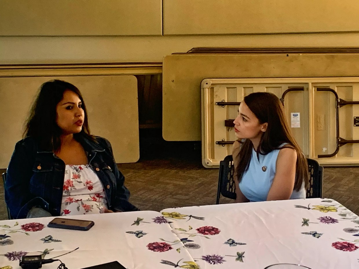 AOC, Neguse Visit Ingrid Encalada Latorre in Sanctuary Church in Boulder