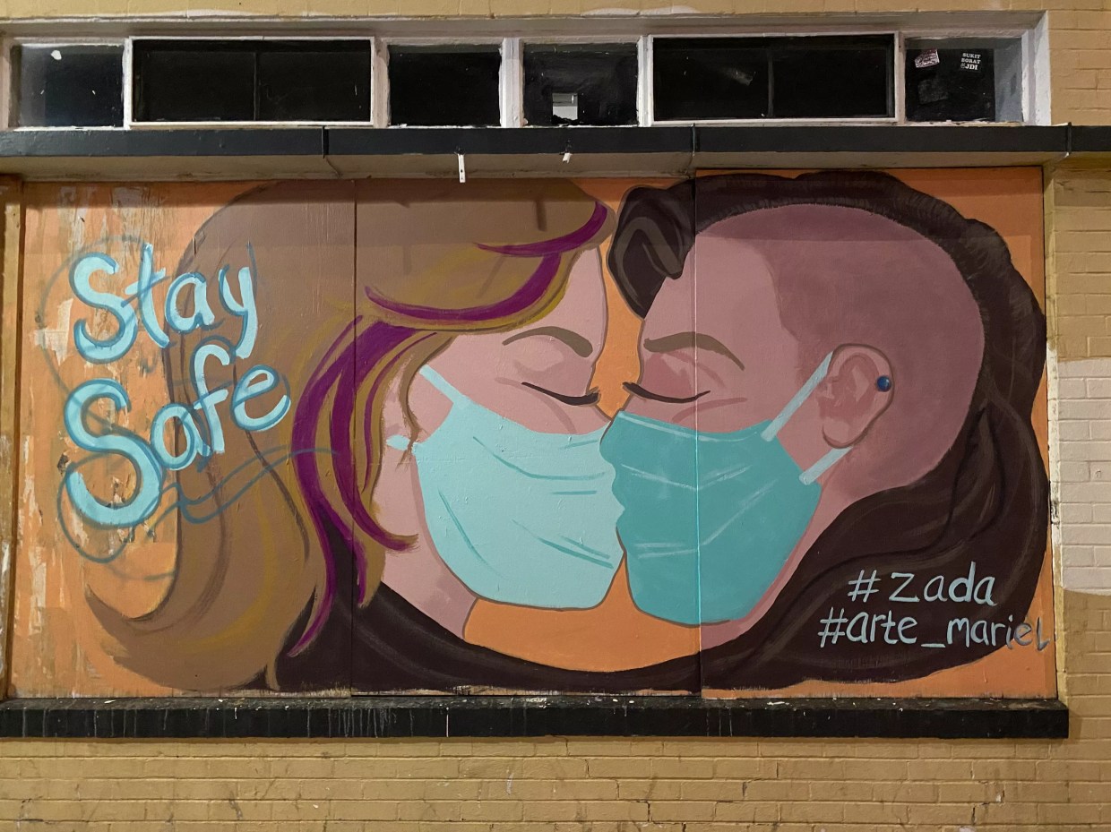 Gulp! Artists Attacked While Painting Mural of Masked Women Kissing