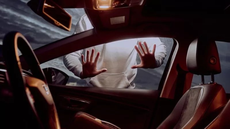 Photo illustration of a car theft.