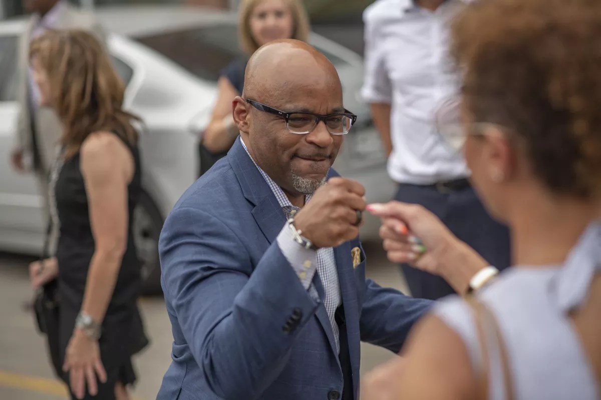 Denver Mayor Michael Hancock celebrates during a public event