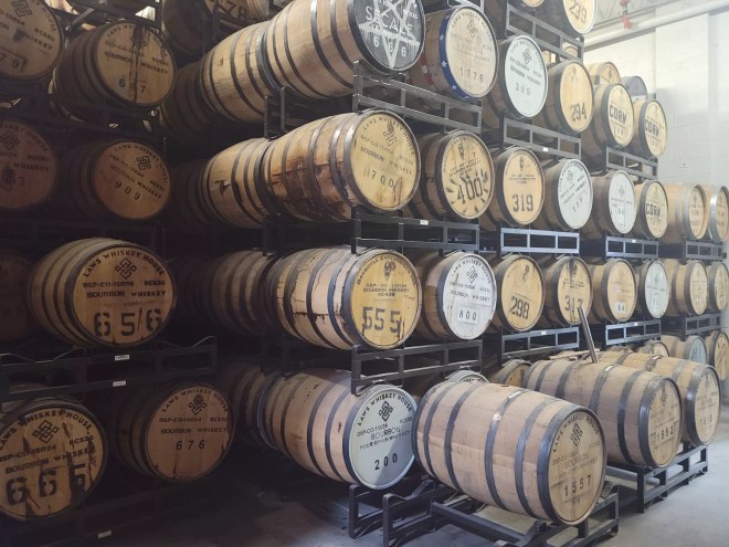 barrels on racks in a distillery