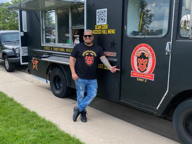 man standing in front of a food truck