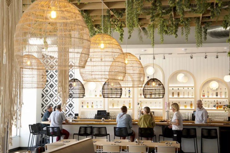 interior of a restaurant with macrame light fixtures