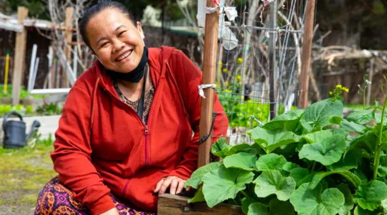 woman smiling in a garden