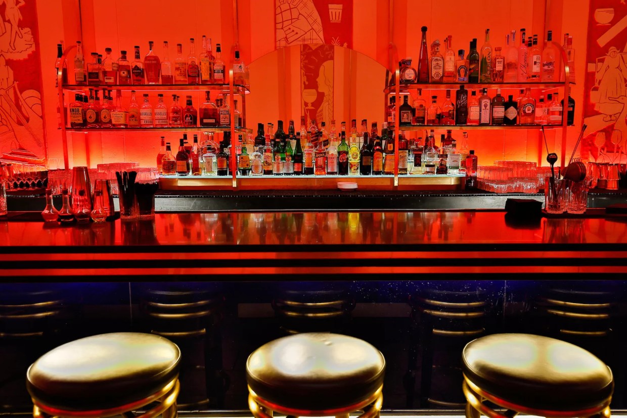 a bar with red lighting