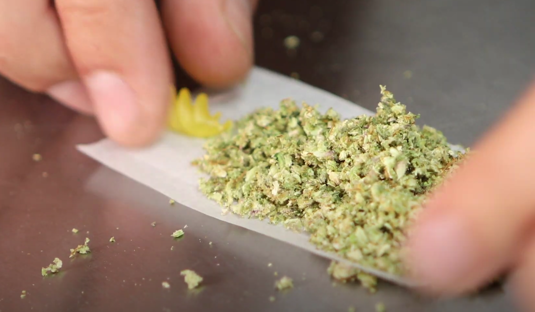 perosn rolls joint with noodle crutch