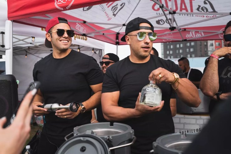 two men in black t-shirts