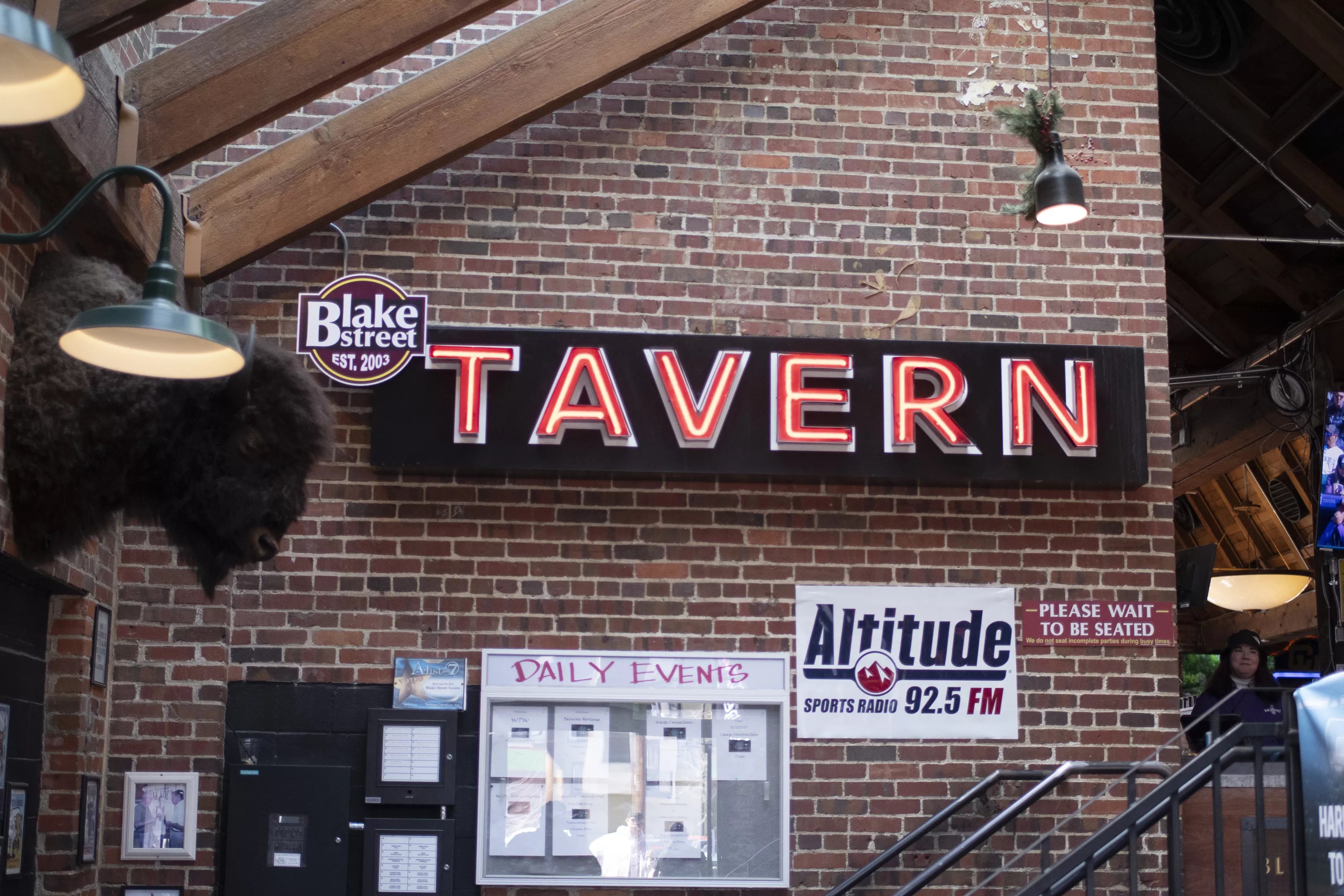 a "Tavern" sign inside a bar