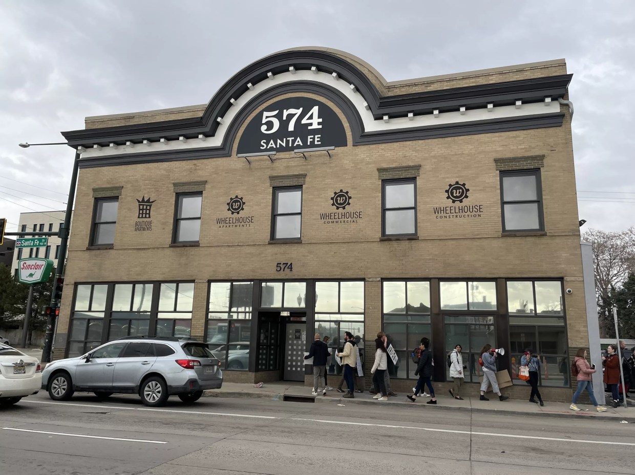 The Clarkson tenants picketing in front of Boutique Apartments in Denver, Colorado, on April 19.